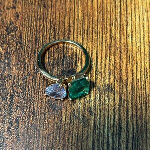 Gold band with green and clear cubic zirconia, square and pair cut stones